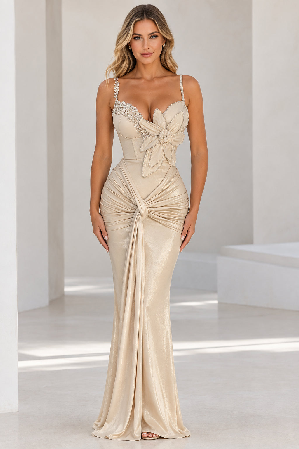 Champagne shimmer mermaid evening gown with floral appliqué and rhinestone straps front view