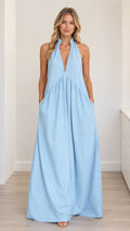 Light blue halter V-neck sleeveless maxi dress front view with hands in pockets