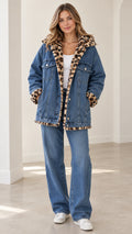 Front view of model wearing blue denim hooded jacket with leopard plush lining and wide-leg jeans set