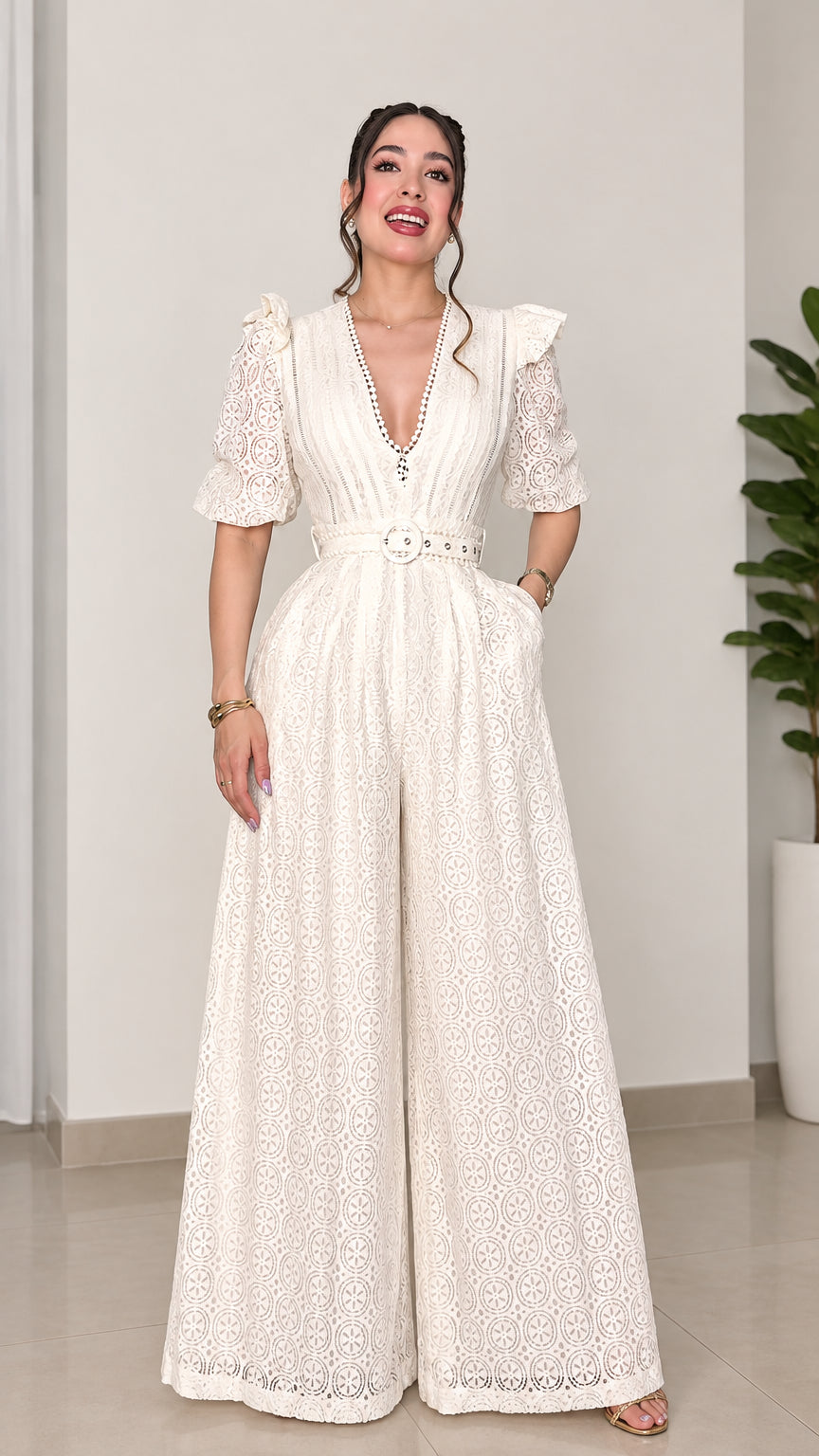 Front view of woman wearing ivory lace wide-leg belted jumpsuit with V-neckline