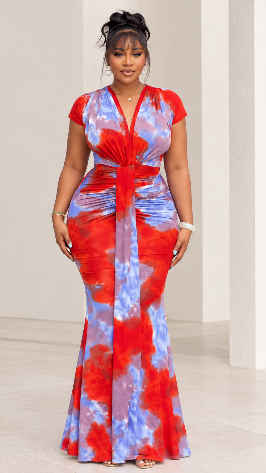 Full front view of model wearing red and blue tie-dye V-neck maxi dress with center knot ruching