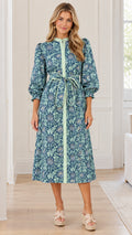 Front full view of woman wearing teal blue floral print midi shirt dress with tie waist belt