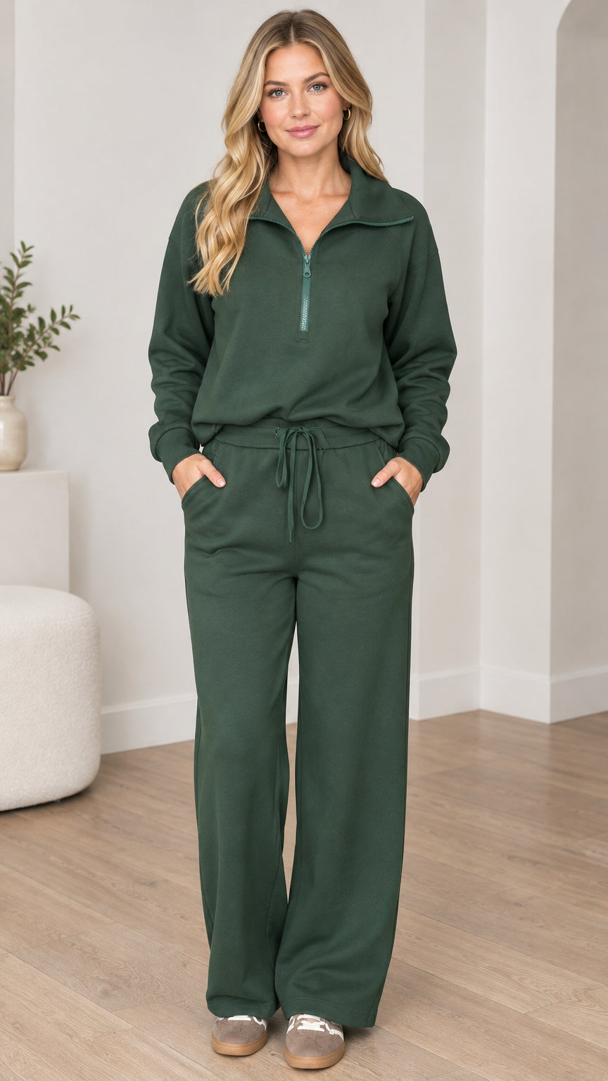 Front view of model wearing forest green half-zip sweatshirt and wide-leg lounge pants set