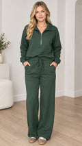 Front view of model wearing forest green half-zip sweatshirt and wide-leg lounge pants set