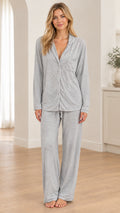 Front full view of woman wearing Heather Grey long sleeve button-down pajama set with contrast piping
