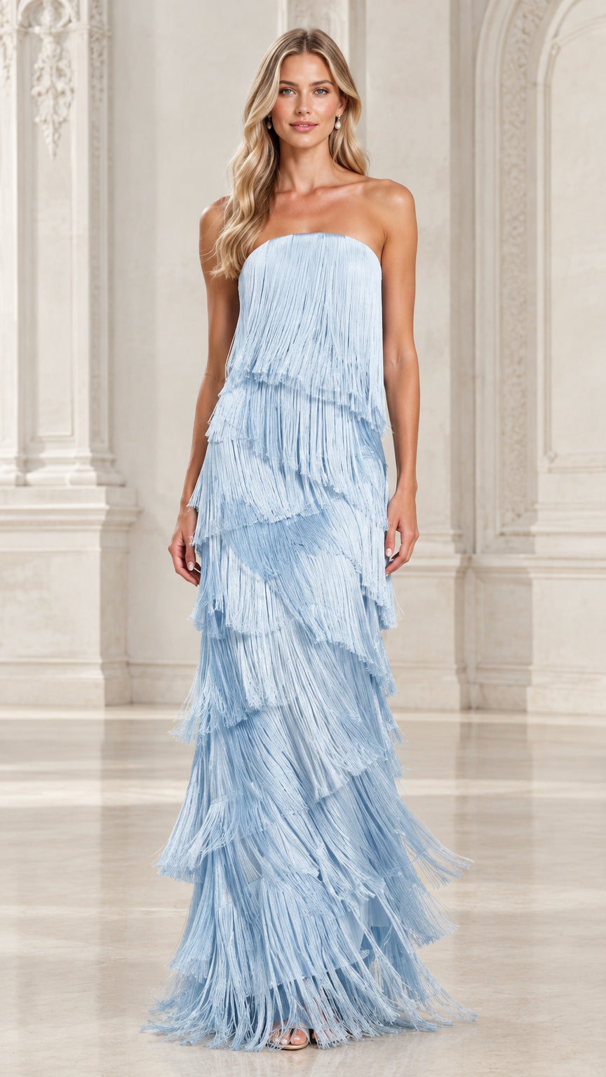 Front view of model wearing a light blue strapless tiered fringe maxi evening gown