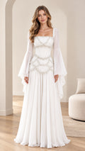 Front view of model wearing white pearl-embellished Renaissance maxi dress with flared bell sleeves