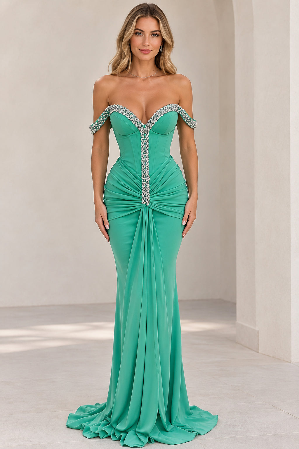Front view of model wearing emerald green off-the-shoulder rhinestone corset evening gown
