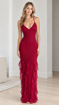 Front view of model wearing a ruby red beaded mermaid evening gown with cascading ruffles