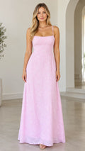 Front view of woman wearing pink floral jacquard maxi dress with square neckline