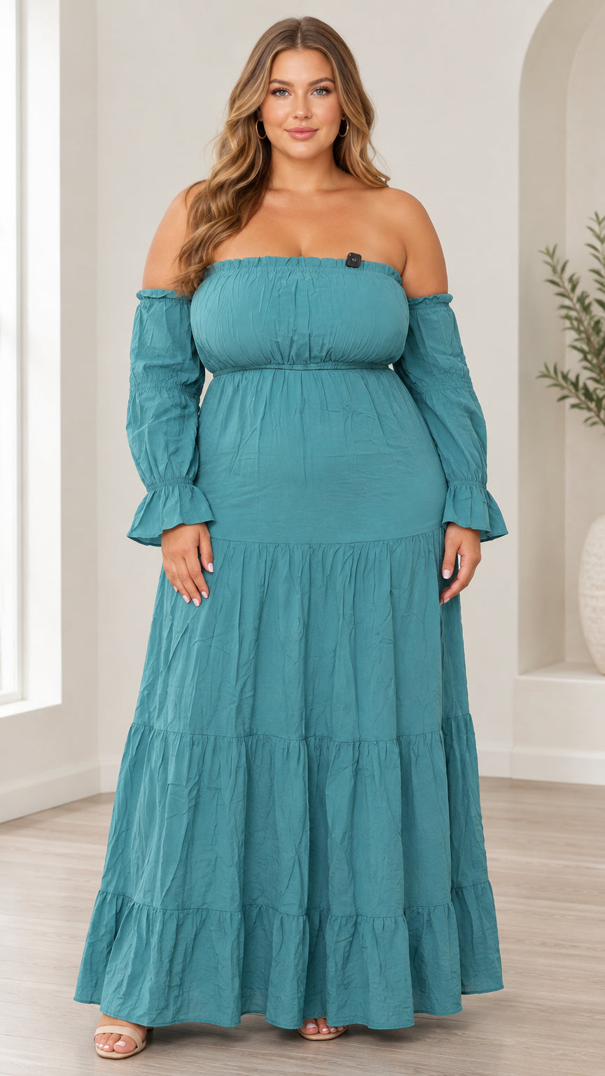 Front view of model wearing teal off-the-shoulder tiered maxi dress with flared sleeves
