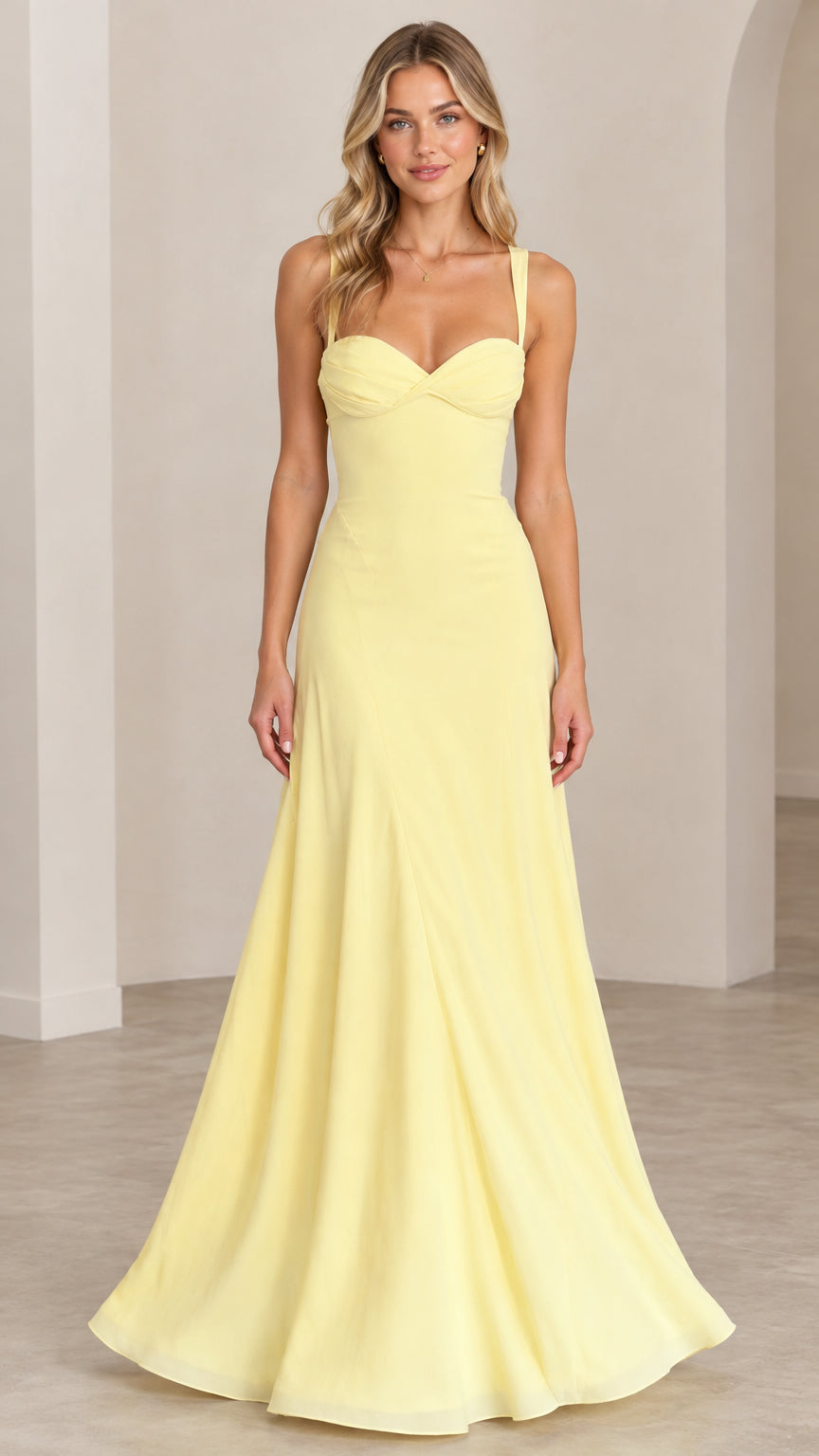 Front full-length view of model wearing pastel yellow sweetheart maxi evening gown