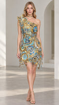 Front view of model wearing a light blue and gold one-shoulder embellished clockwork mini dress with fringe hem