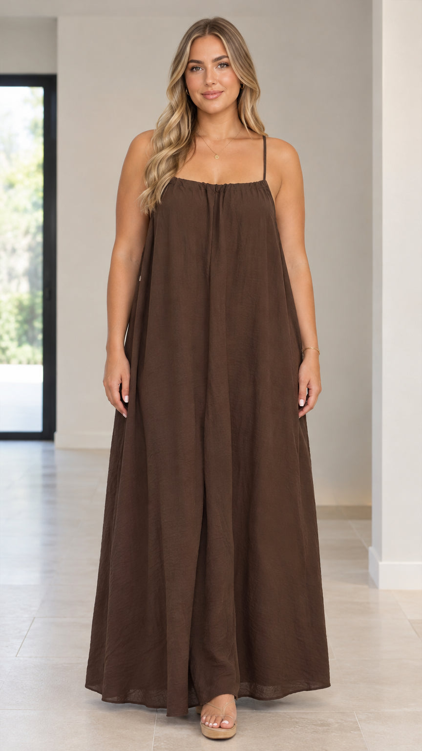 Front view of model wearing a brown sleeveless wide-leg spaghetti strap jumpsuit
