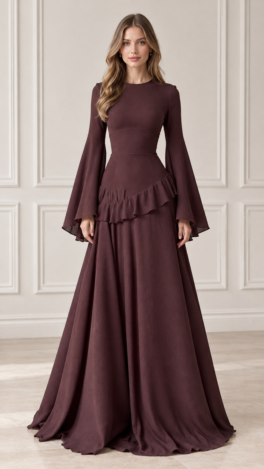 Front full-length view of model wearing burgundy flare sleeve maxi dress with ruffled waist