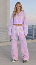 Front full view of woman wearing lavender rhinestone cropped hoodie and wide leg sweatpants set