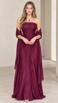Front view of model wearing burgundy strapless pleated evening gown with matching shawl