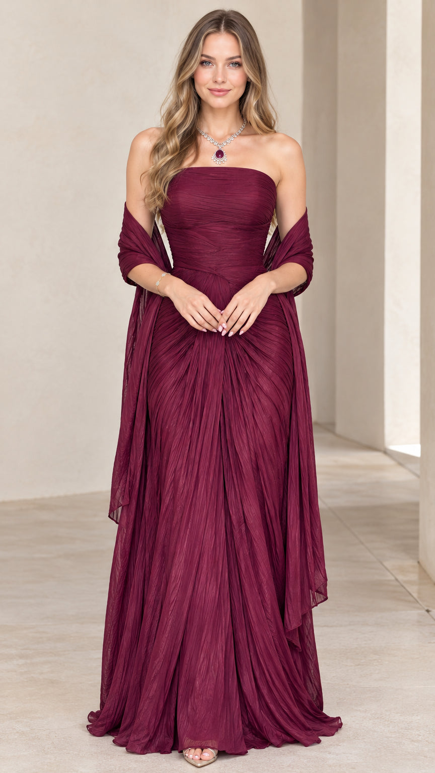 Front view of model wearing burgundy strapless pleated evening gown with matching shawl