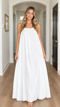 Front view of model wearing white gathered spaghetti strap maxi dress