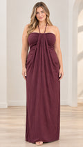Front full-length view of model wearing burgundy halter neck draped maxi dress