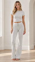 Front view of woman wearing Light Gray two-piece crop tee and flare lounge pants set