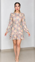 Front full-length view of model wearing Blush Pink floral lace long sleeve mini dress with tiered ruffle hem
