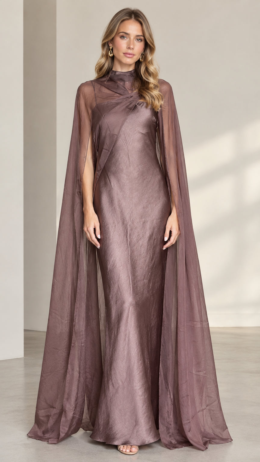 Front full-length view of dusty mauve high neck evening gown with sheer cape overlay