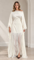 Front full view of woman wearing ivory lace trim fringe maxi dress