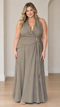 Plus size model wearing sage green halter maxi dress with ruched waist and buckle detail - front view