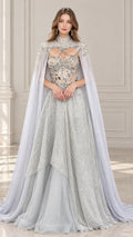 Front view of model wearing silver gray crystal embellished evening gown with high-neck cape