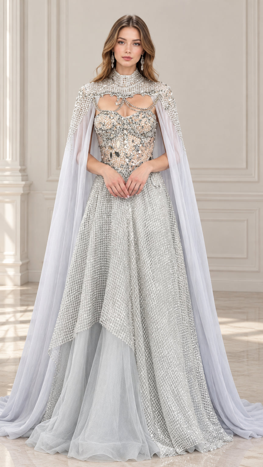 Front view of model wearing silver gray crystal embellished evening gown with high-neck cape