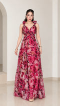 Front view of woman wearing magenta floral ruffled plunge chiffon maxi dress