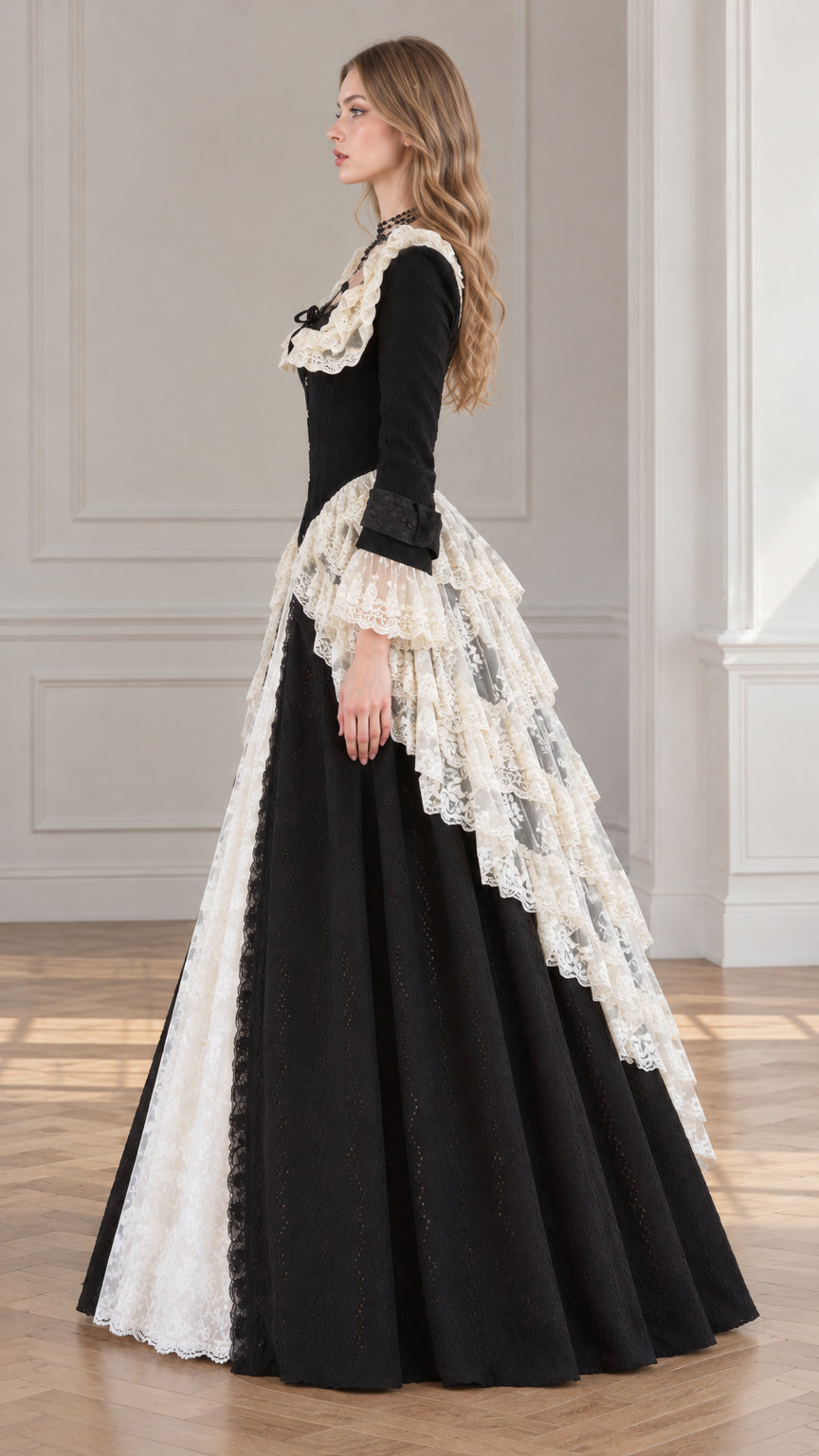 Side angle of black Victorian ball gown showing cascading hip lace details
