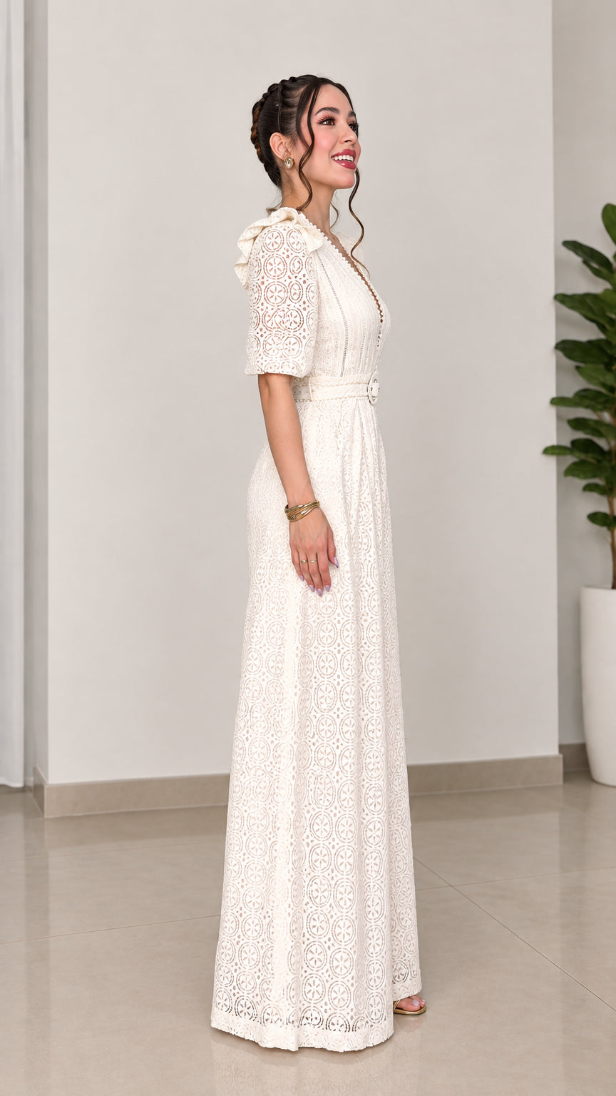 Side view of woman posing in ivory lace wide-leg belted jumpsuit