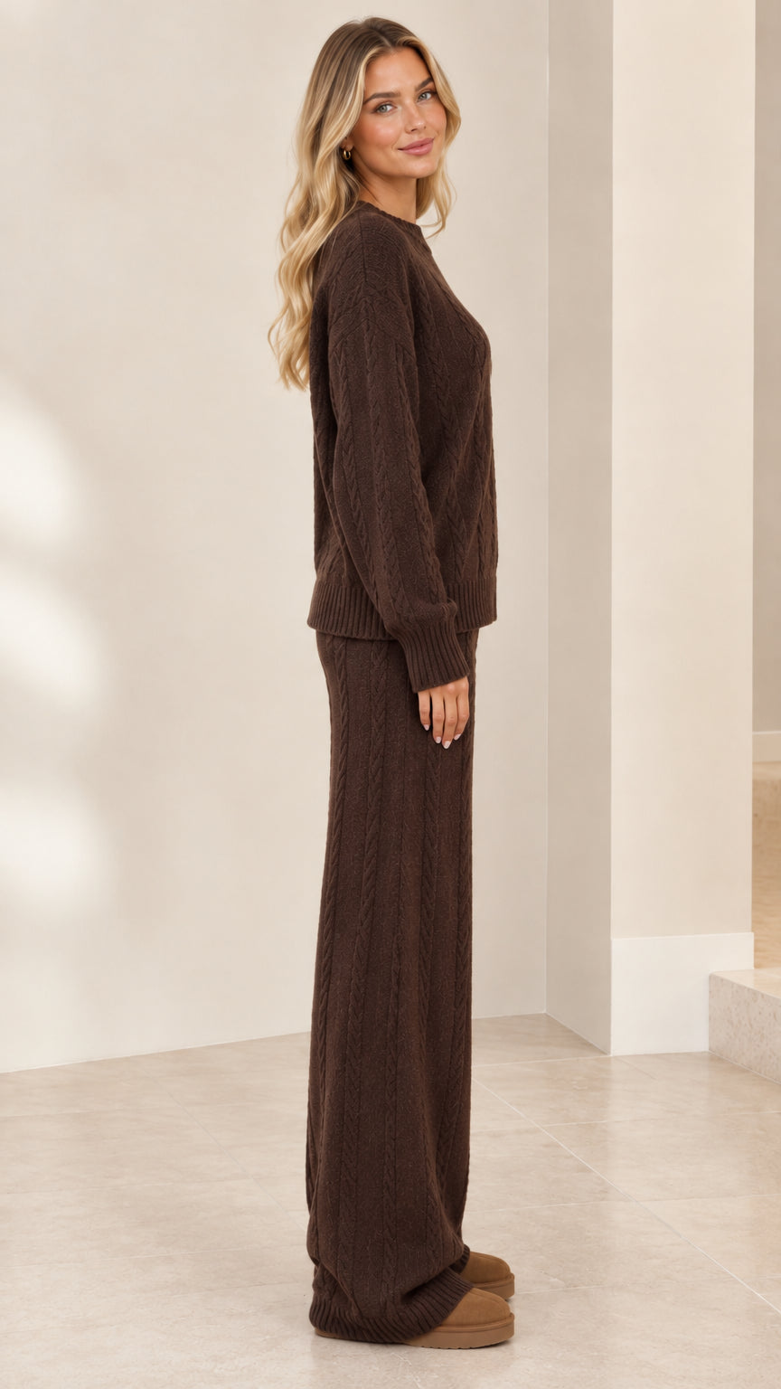 Side profile view of model wearing brown 2-piece cable knit sweater and pants set