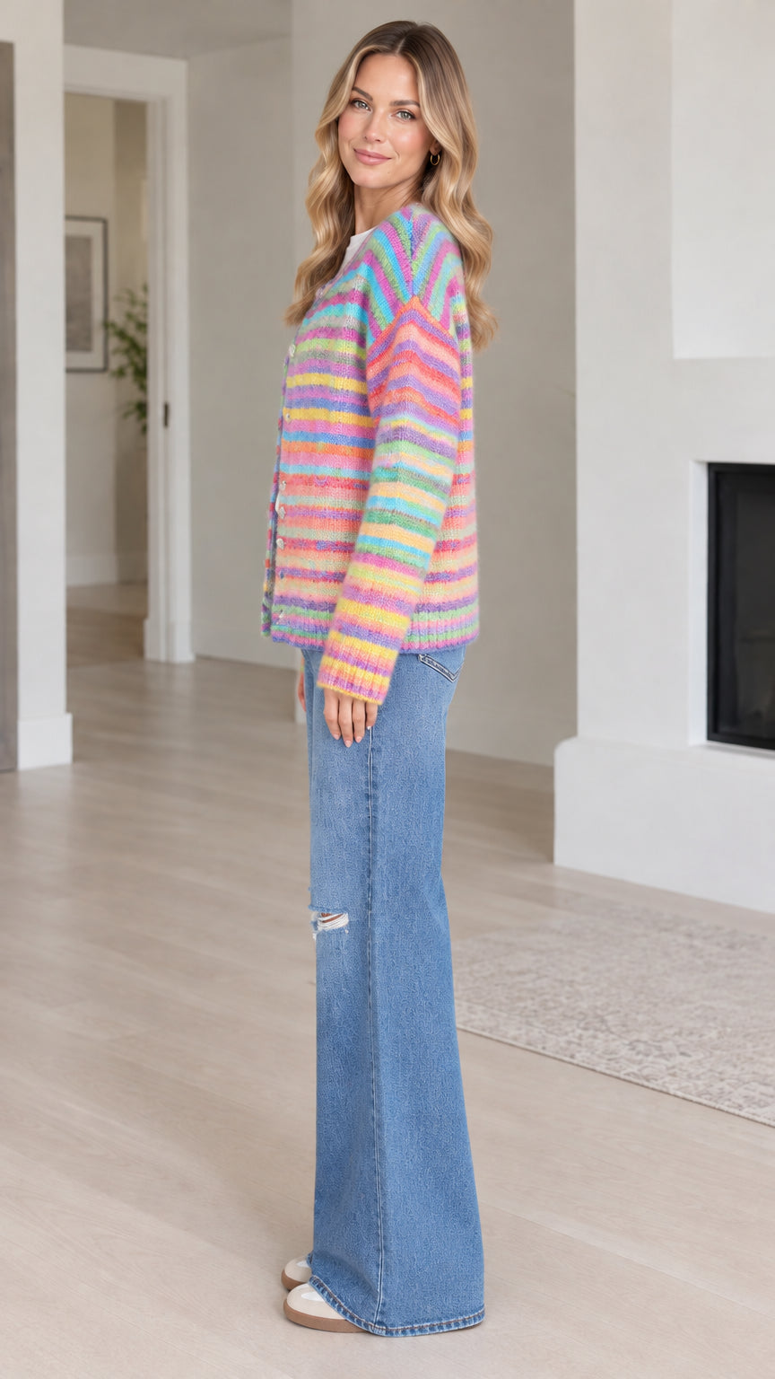 Side profile view of Rainbow Multi striped crewneck knit cardigan