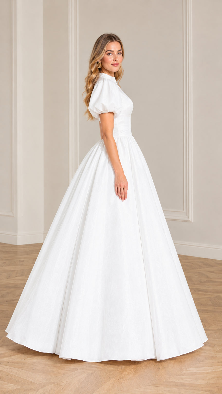Side profile view of a woman in an elegant white puff sleeve floor-length gown