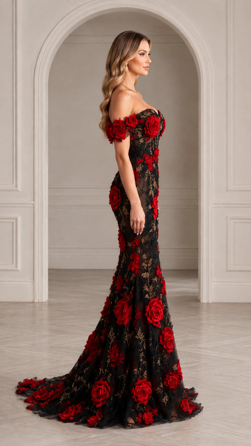 Side profile of black mermaid gown with red 3D rose appliqués and floor-sweeping train