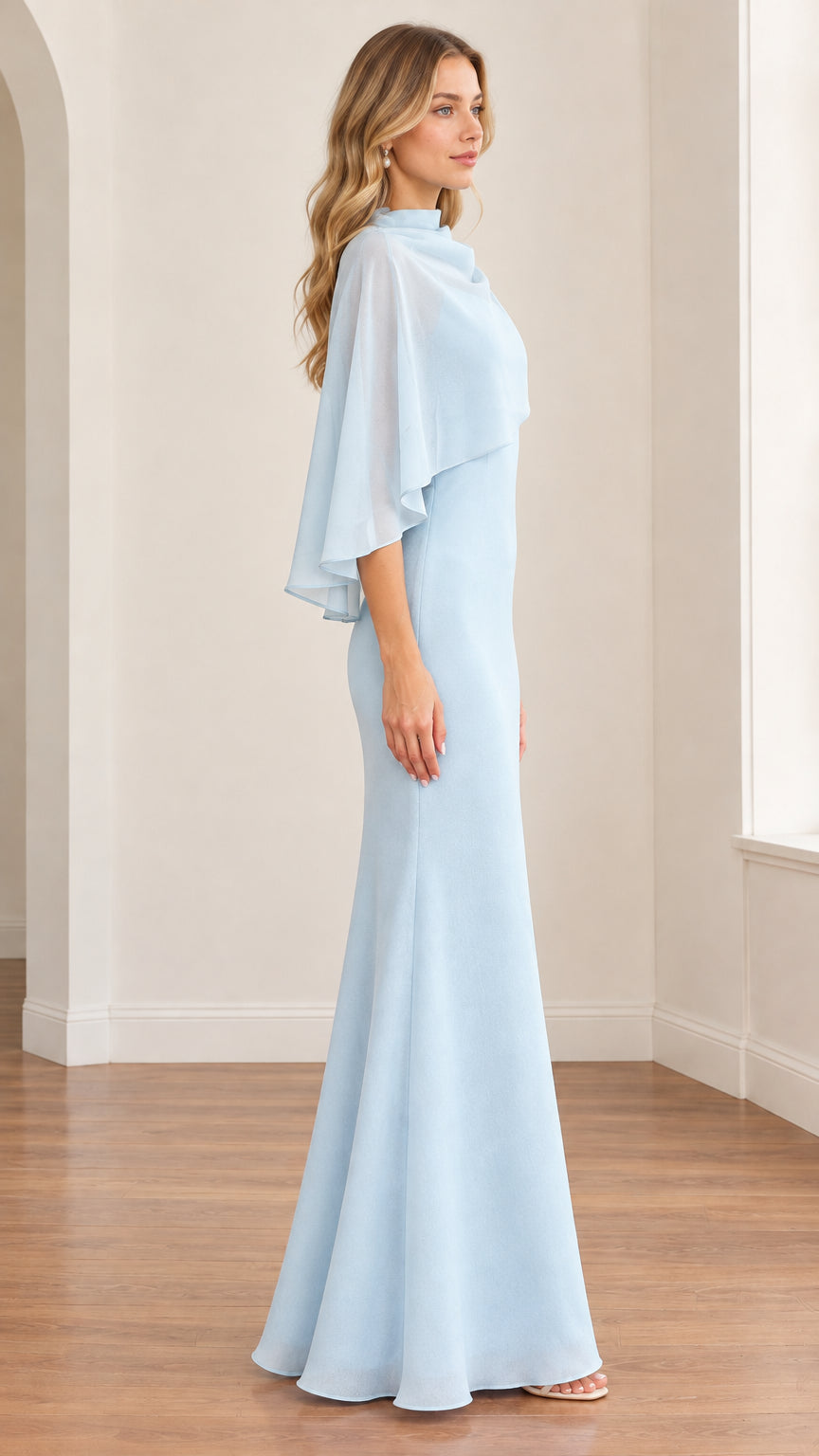 Side profile view of model wearing the light blue capelet formal maxi gown