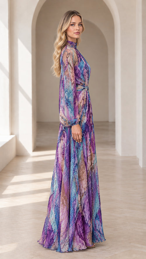 Side profile view of woman wearing flowing purple multicolor long sleeve maxi dress