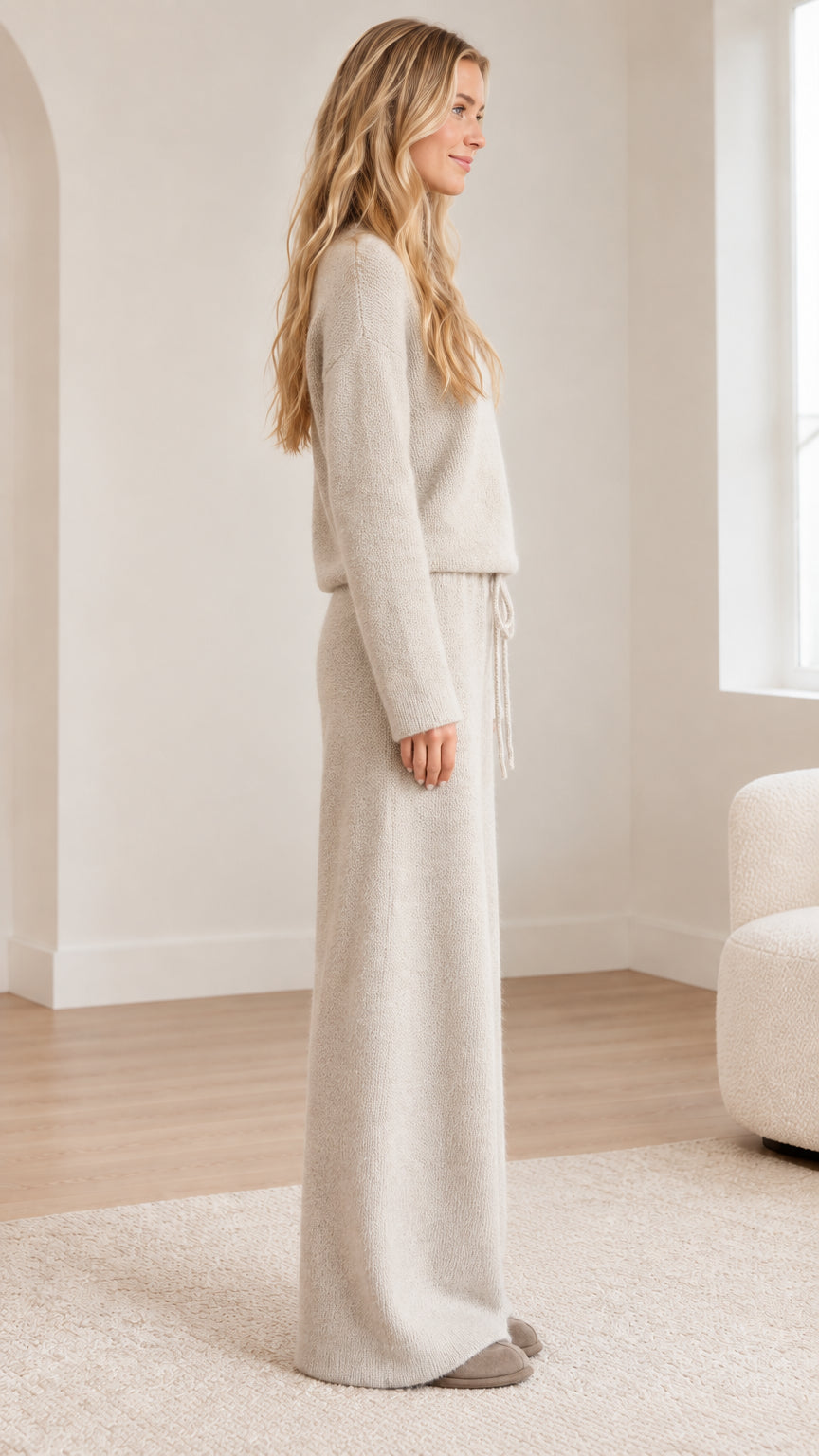 Side profile view of oatmeal knit sweater and wide-leg pants two-piece set