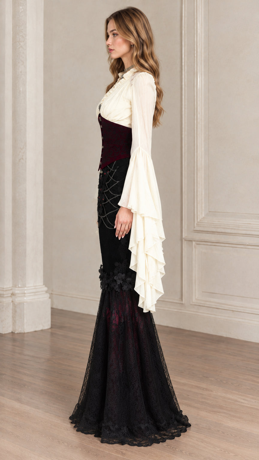 Side profile of model in black and burgundy corset mermaid dress showing silhouette