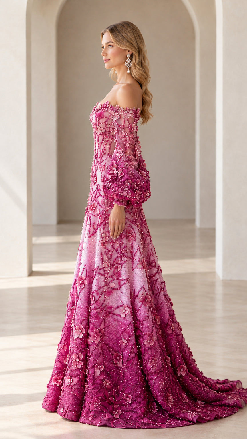 Side profile view of model wearing ombre pink floral embroidered ball gown