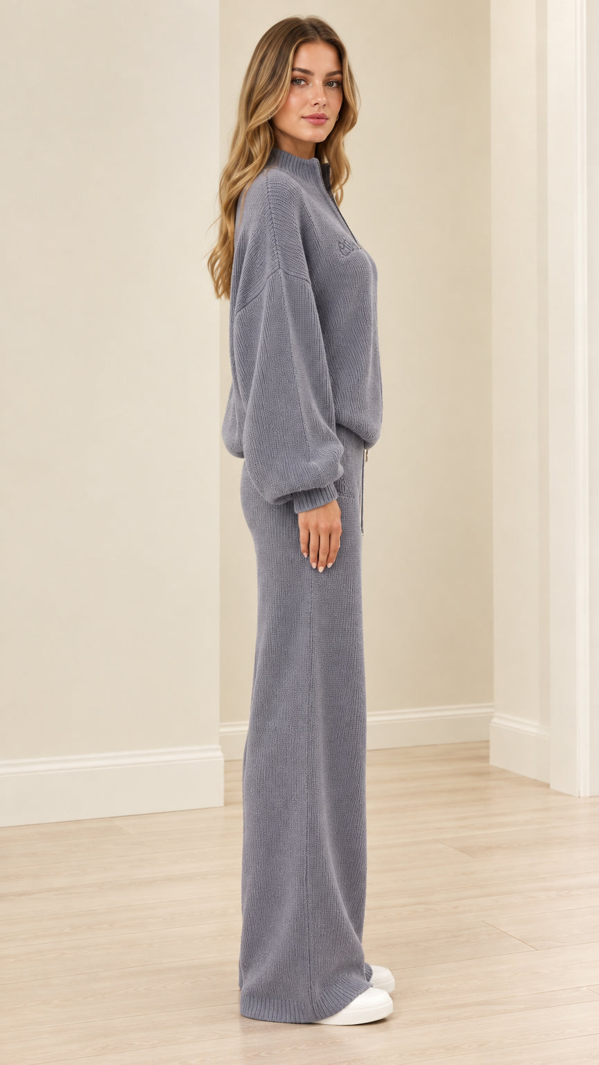Side view of woman wearing dusty blue ribbed knit matching tracksuit set