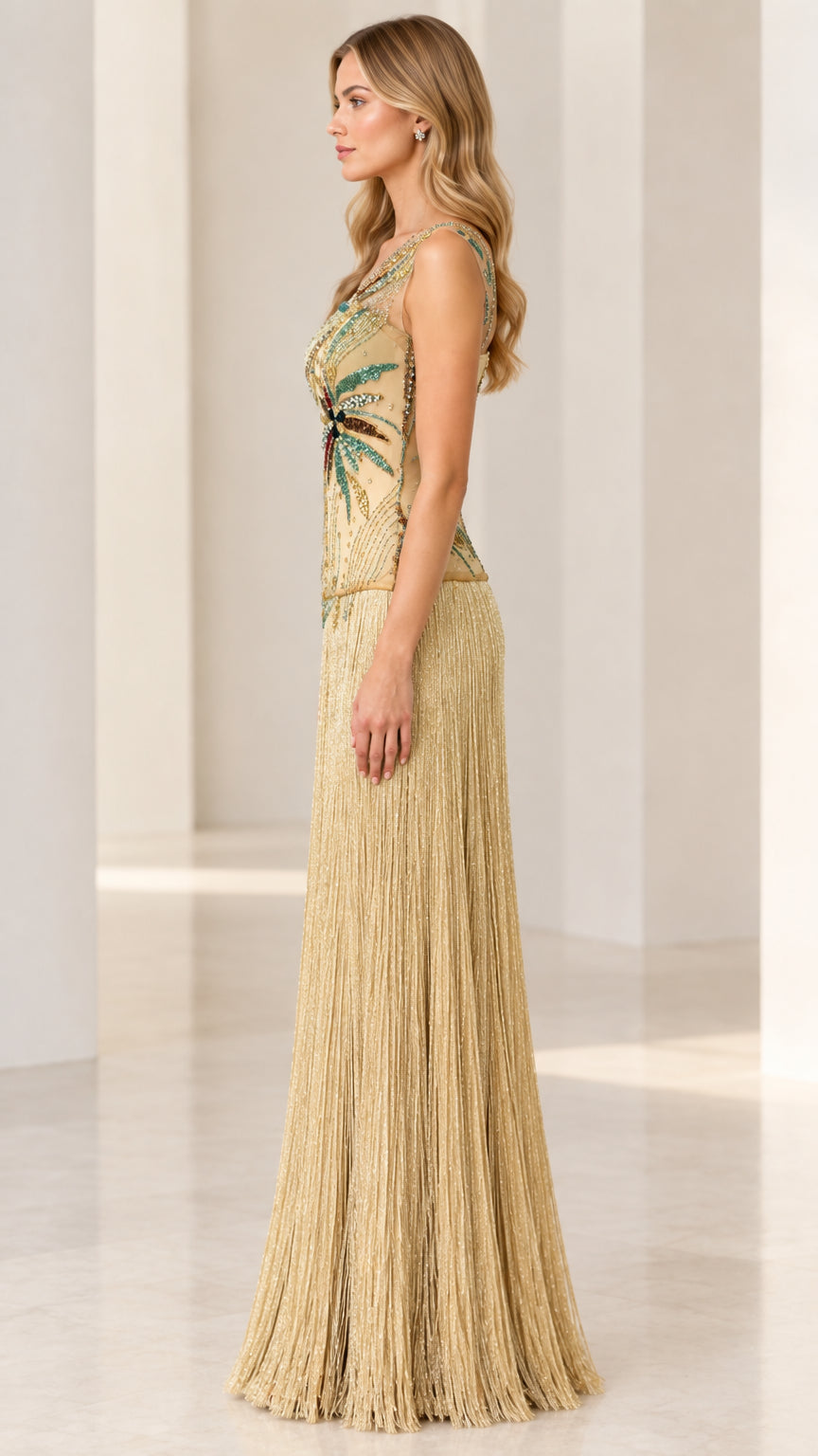 Side profile view of gold one-shoulder beaded fringe formal dress