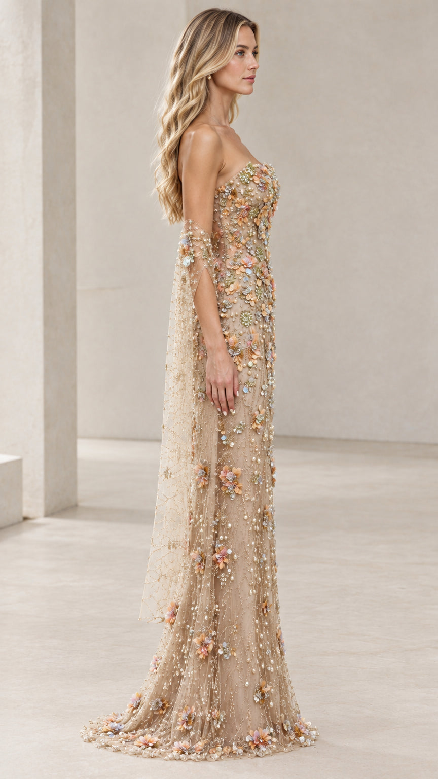 Side profile of champagne floral applique formal maxi gown with flowing train
