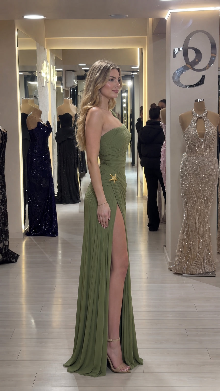 Side profile of model in olive green draped maxi dress showing high thigh slit