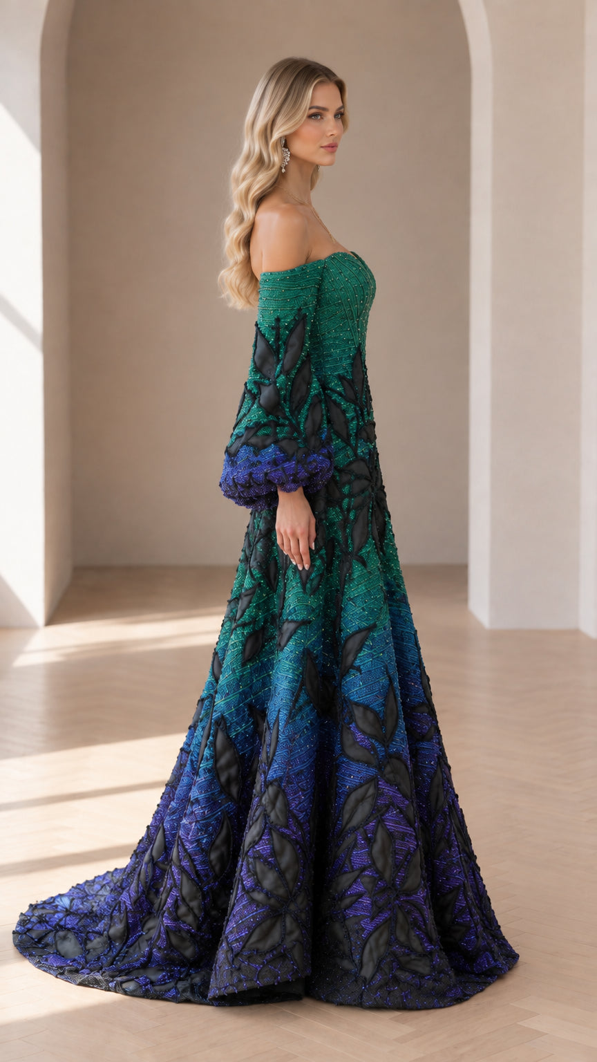 Side profile view of green ombre floor-length formal gown with dramatic embellished sleeves