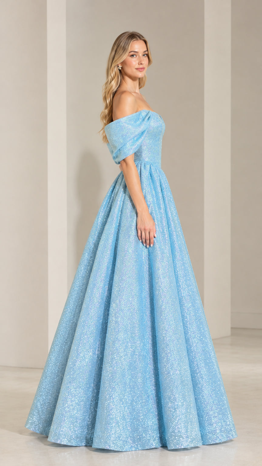 Side profile of model wearing light blue glittering floor-length ball gown