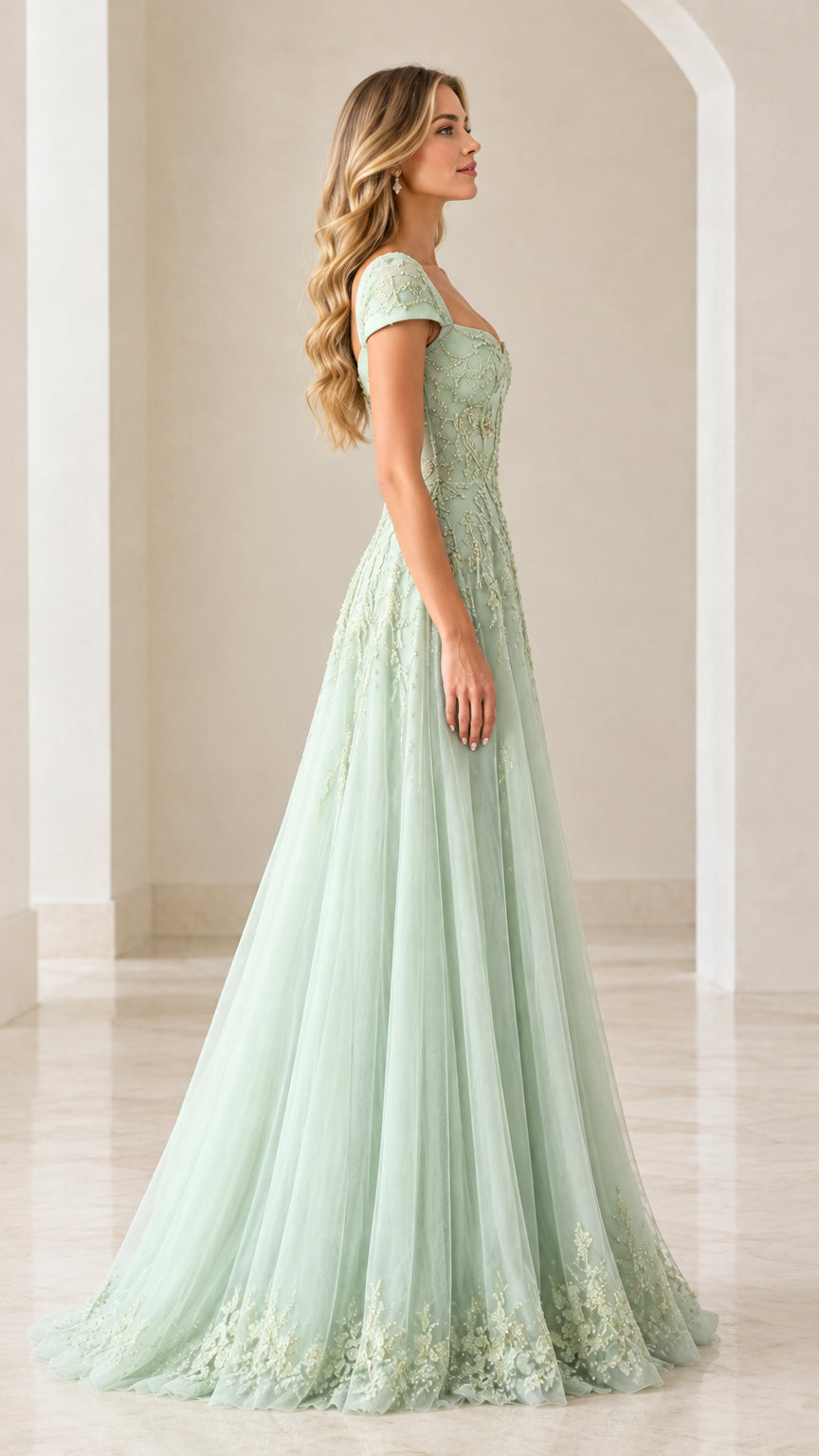 Side profile of sage green embroidered tulle ball gown